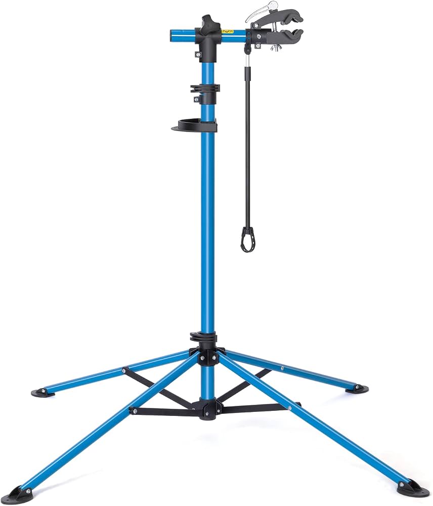 support-velo-atelier-102lmo-1.jpg CXWXC Support de montage de vélo réglable en hauteur rotatif à 360° avec grand plateau à outils robuste pour VTT, jusqu'à 30 kg (bleu) : Amazon.fr: Sports et Loisirs – Image 1